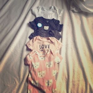 5 cat themed onesies, pink and gray